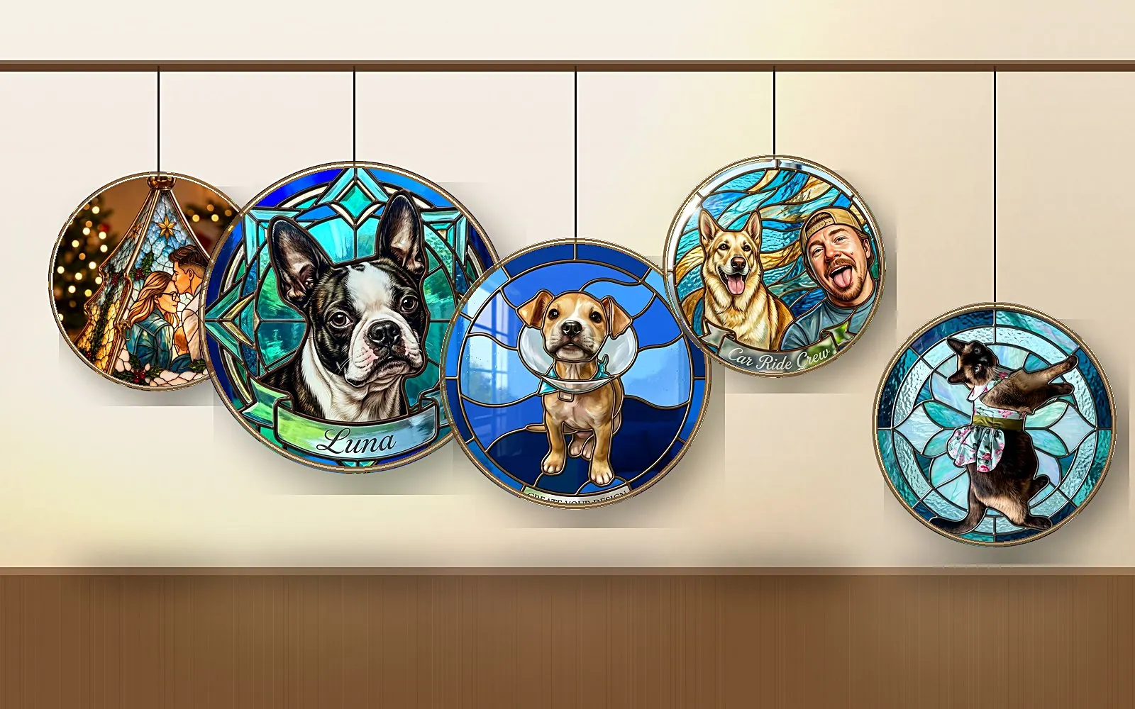 A wall of finished Lumera suncatchers hung on a rail: pet portraits in blue, amber and rose glass, lit from the side